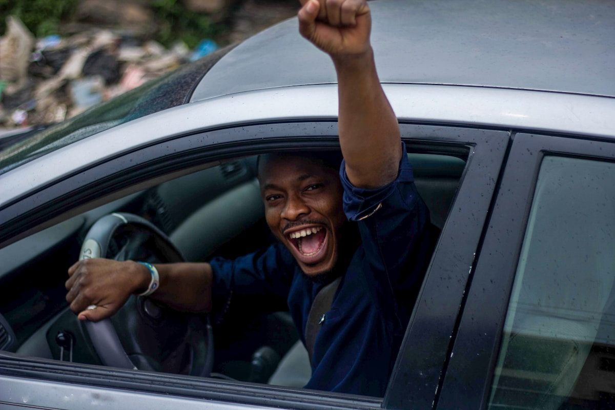 Delighted owner in his newly delivered car