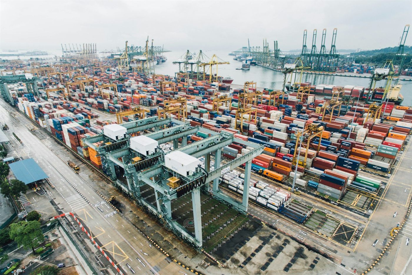 Aerial view of a container port with gantry cranes